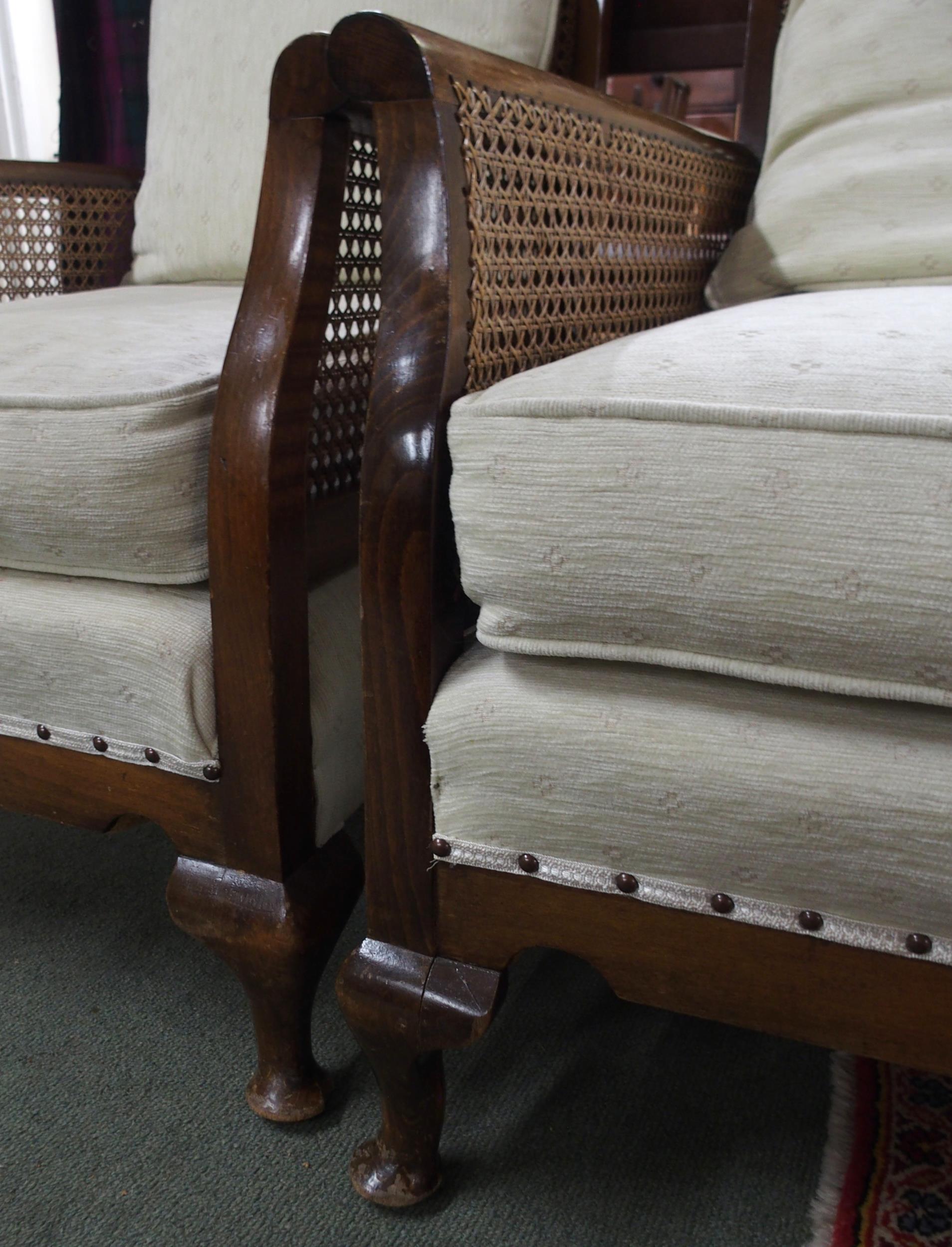 A 20th century mahogany framed bergere three piece suite with two seater sofa and pair of - Image 4 of 5