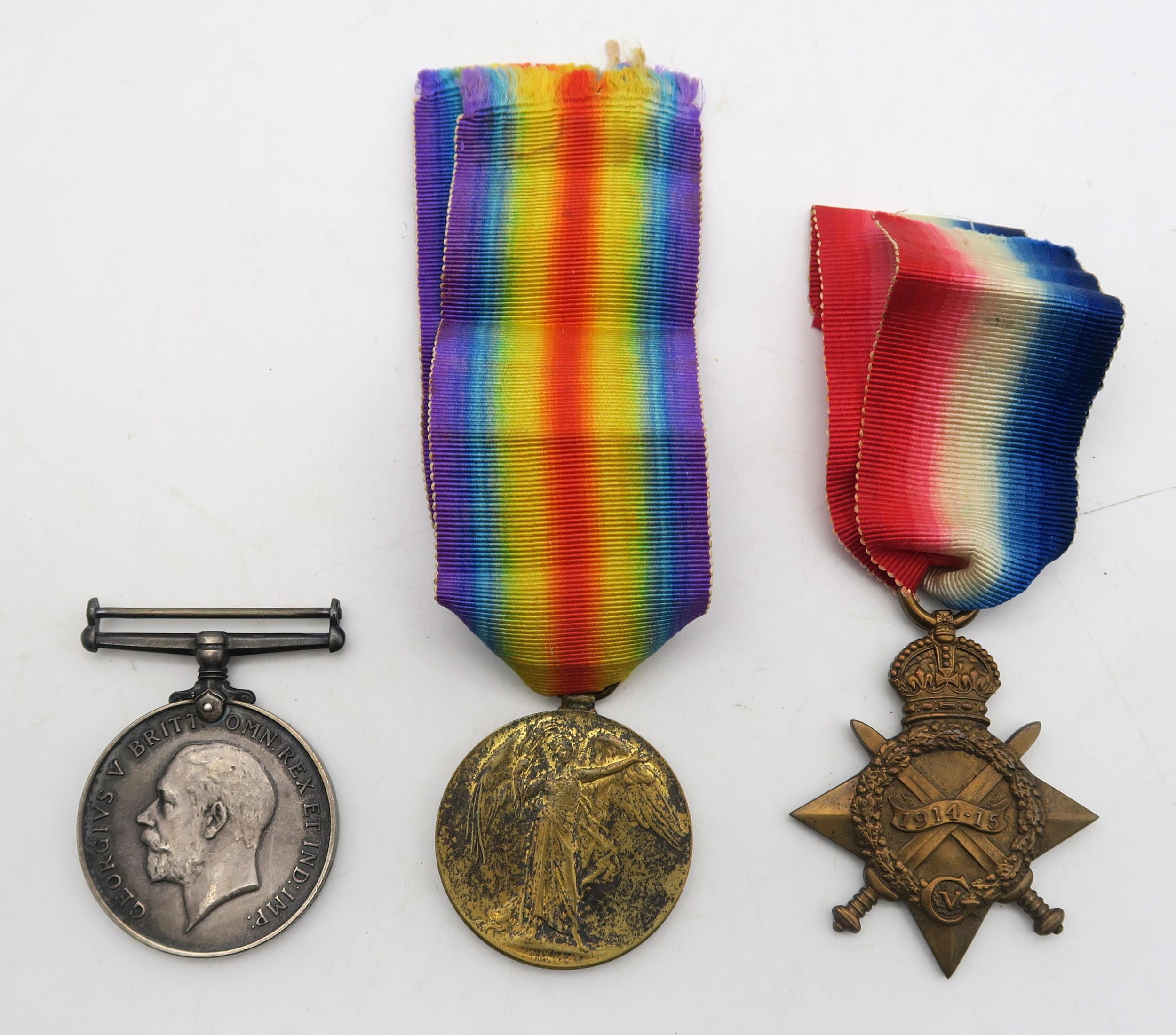 Three WW1 medals: a British War Medal and Victory Medal awarded to S-9875 Pte. R. Proctor of the