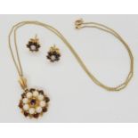 A 9ct gold garnet and pearl flower pendant and chain, with similar earrings weight combined 7.2gms