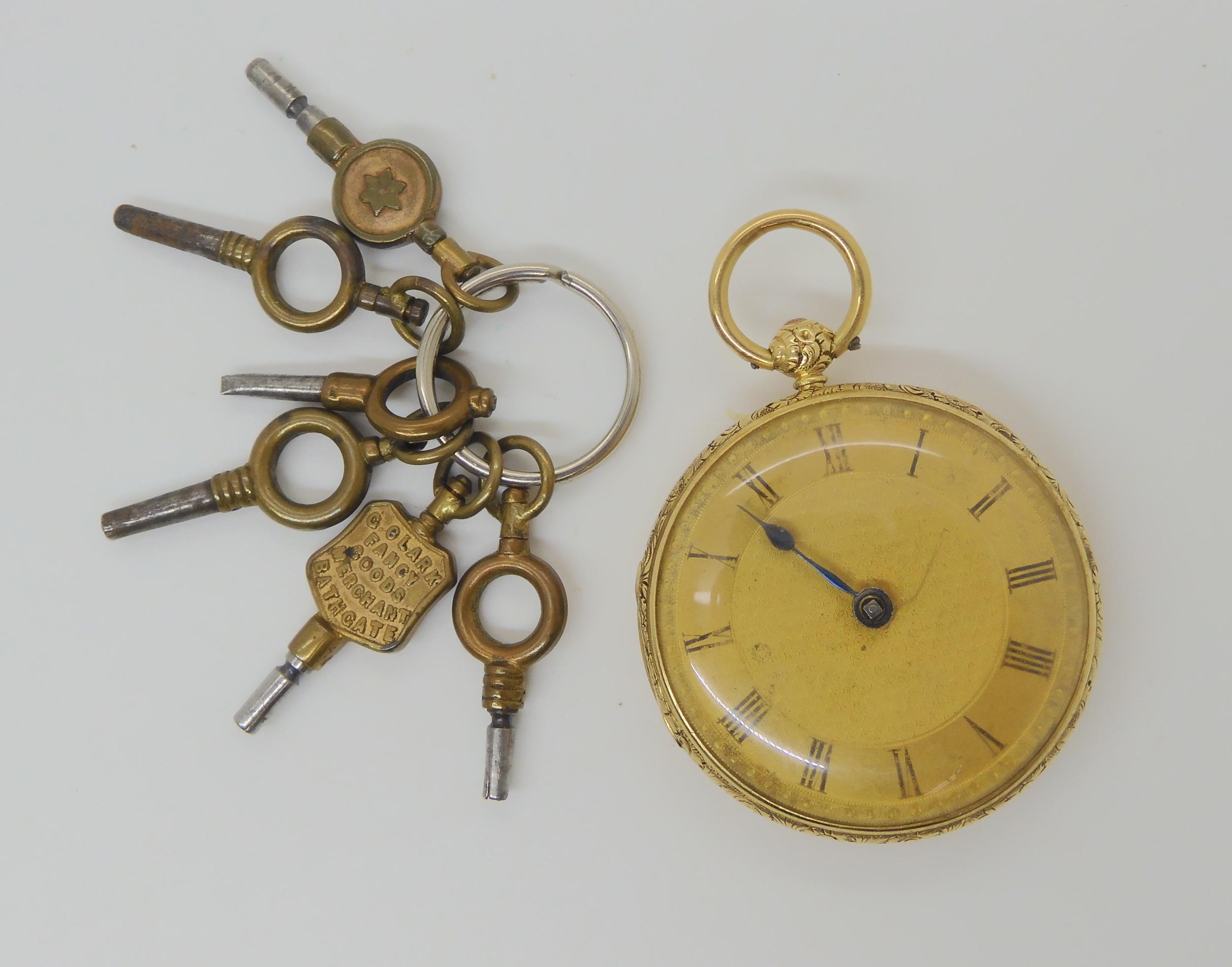 An 18ct gold open face fob watch, diameter 4cm, weight including mechanism 53.3gms With a collection