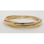 A 9ct three colour gold Russian wedding band style bangle, weight 13.7gms Condition Report:Available