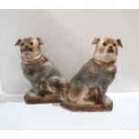 A pair of Bo'Ness pottery pug dogs Condition Report:Available upon request