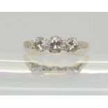 An 18ct and platinum classic three stone diamond ring, set with estimated approx 0.50cts of