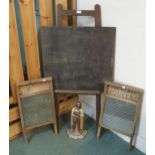 A 20th century chalk board, two "the glass queen" wash boards and a cast metal fireside knight (4)