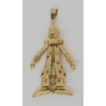 A 9ct gold gem set large clown pendant, length including bail 8.5cm, weight 40.7gms Condition