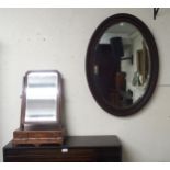 A Victorian mahogany three drawer toilet mirror and an oval bevelled glass wall mirror (2) Condition