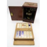 A mahogany-cased microscope, and cased slides, with tissue samples apparently taken from the body of