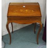 A late Victorian continental style marquetry fall front writing bureau with brass gallery top on