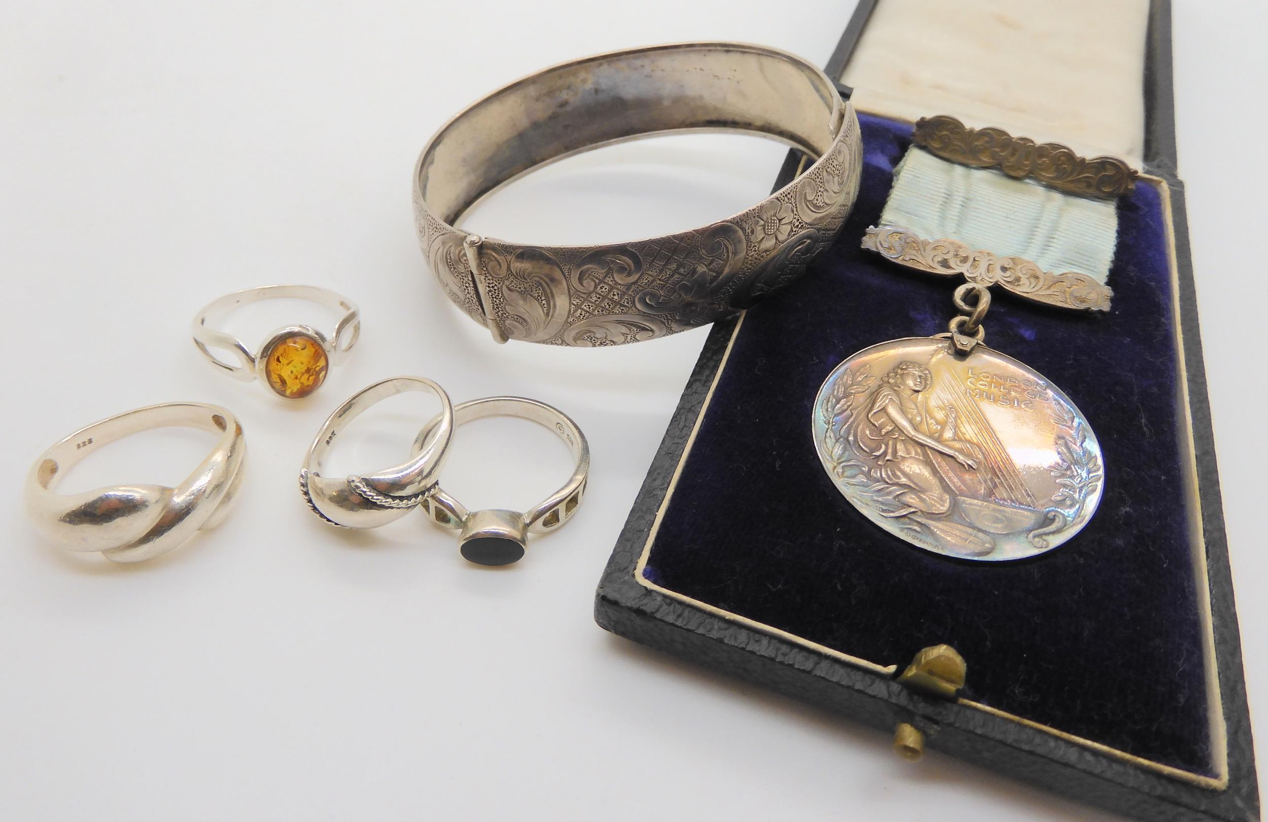 A silver The London College of Music medal, silver rings and a bangle Condition Report:Not available - Image 2 of 3