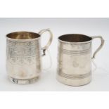 An Edwardian silver christening mug, with engraved bands of scrolling foliate and ribbon decoration,