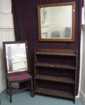 A 20th century oak open bookcase, two bevelled glass wall mirrors and an upholstered stool (4)