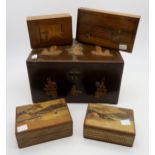 Two Japanese marquetry puzzle boxes, a Latvian marquetry box depicting a medieval knight, a boxed