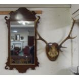 A 20th century walnut and giltwood framed Georgian style wall mirror and a ten point set of