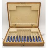 A cased canteen of dyed mother of pearl and silver bladed fruit knives and forks, by Brook & Son,