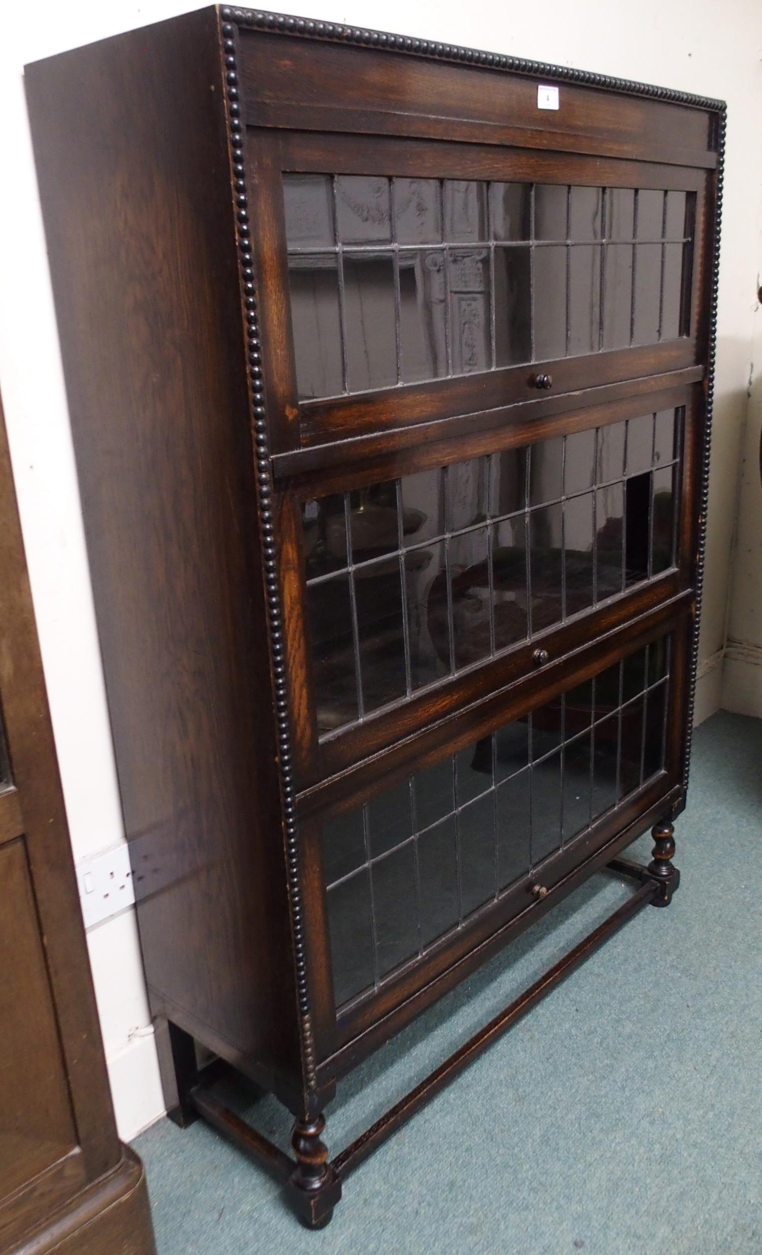 A 20th century oak three tier leaded glass fall front bookcase on stretchered barley twist supports, - Image 2 of 3