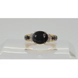 A 10k gold sapphire and diamond accent ring, size O, weight 3.7gms  Condition Report:Available