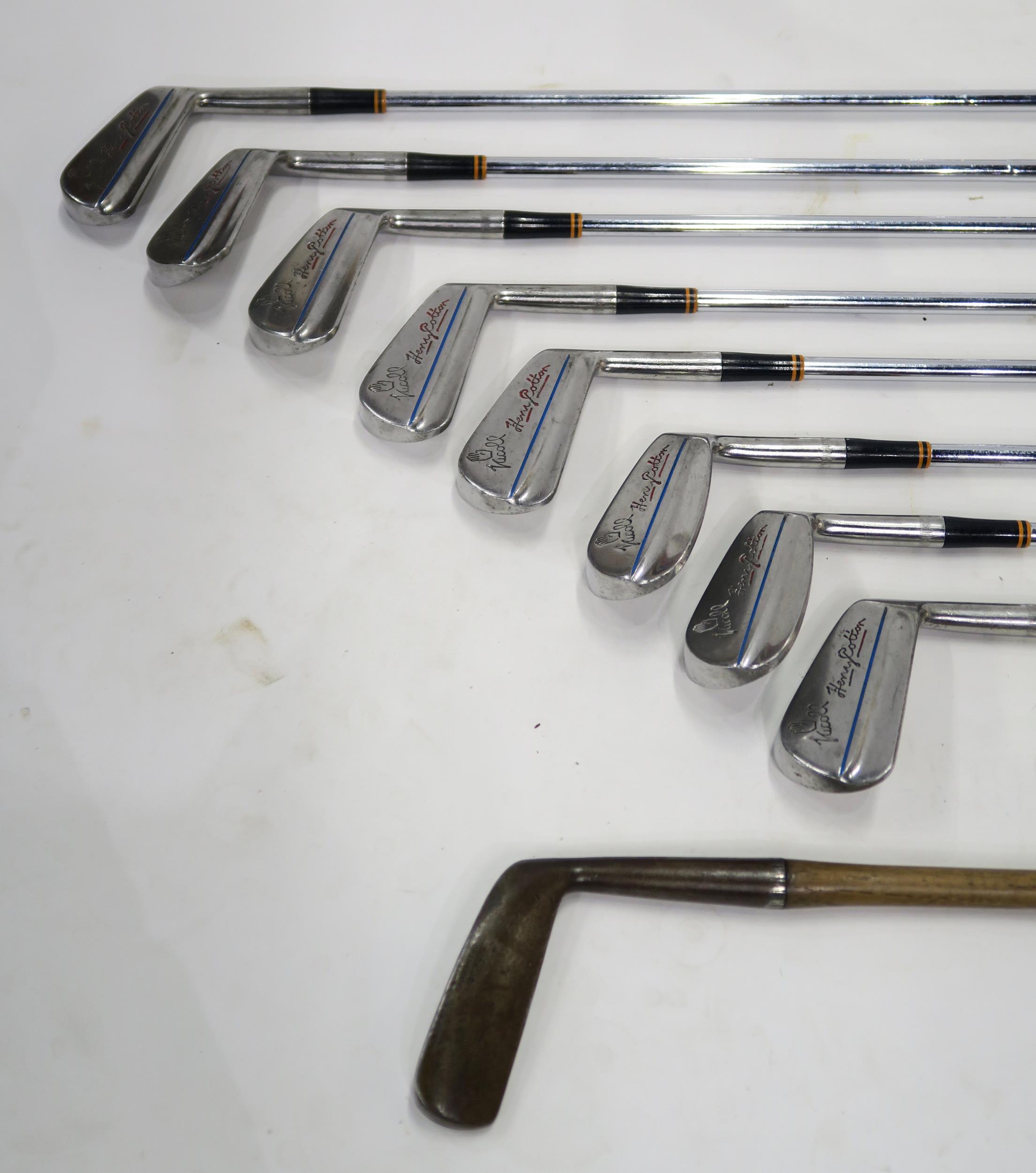 A hickory shaft golf iron by A. Patric, Leven; together with a set of eight 1950s golf irons by
