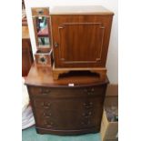 A 20th century mahogany bow front chest of four drawers, mahogany single door cabinet and copper