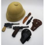 An antler-handled West German hunting knife, a miniature sgian dubh, costume pith helmet and two toy