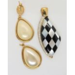 A 9ct gold diamond, mother of pearl and onyx chequer board pendant and a pair of yellow metal