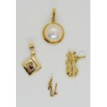 Four 14k gold pendants to include a mabe pearl, key pattern pendant, golf bag and 'U' pendant ,