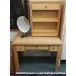 A 20th century pine three drawer dressing table, pine single drawer bedside table and a oval