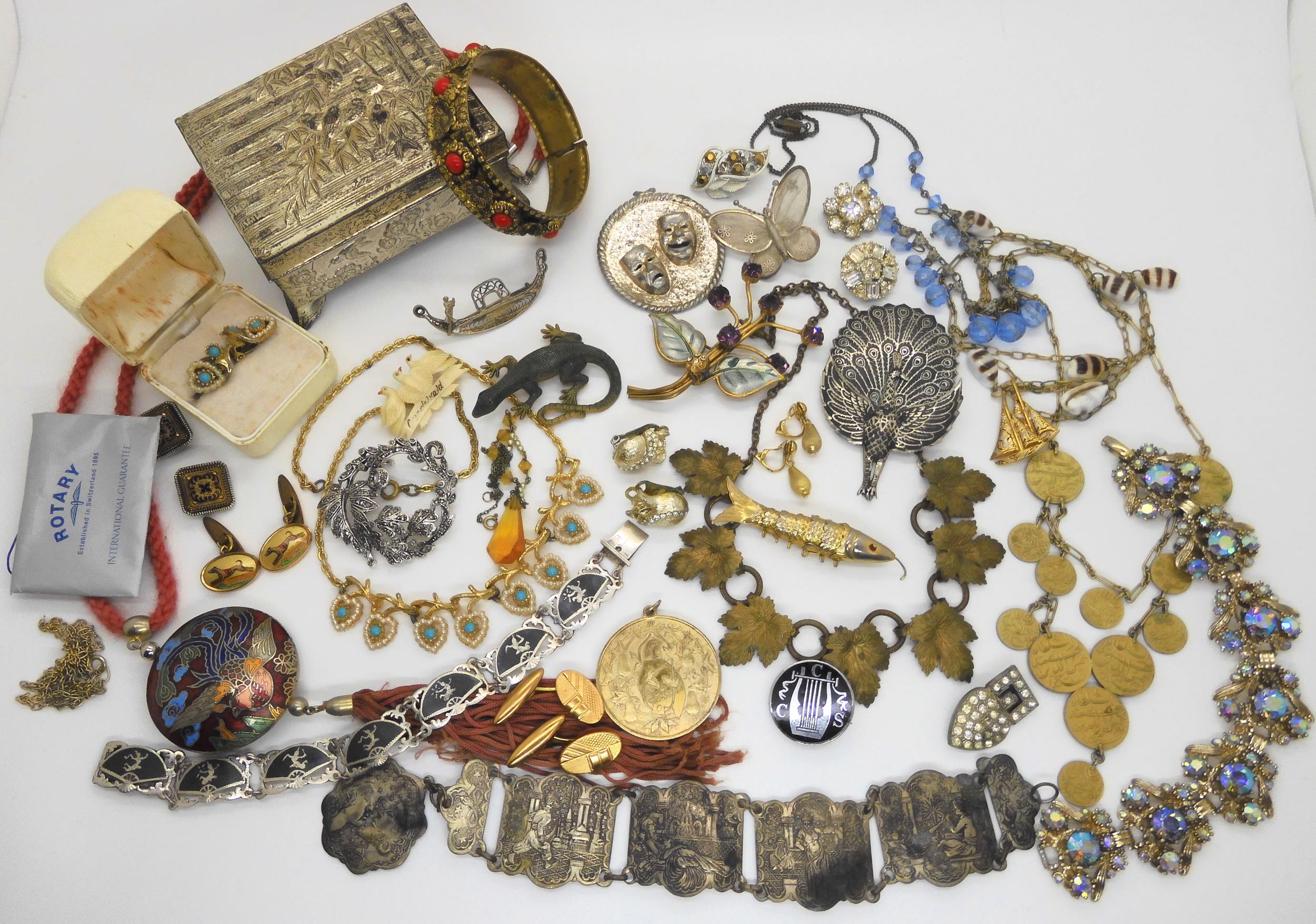 A silver gilt 'Partridge in a pear tree' pendant, a Siam wear peacock brooch and other items