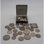 A quantity of three pence and six pence coins together with a late Victorian crown 1900, half crowns
