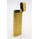 A Cartier Plaque d'Or gold-plated cigarette lighter  Condition Report:Available upon request