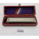 A boxed Super Chromonica harmonica by M. Hohner, Germany Condition Report:Available upon request