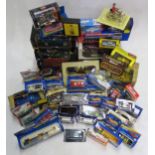 A large quantity of boxed scale model and toy vehicles, to include Burago, Corgi, Dinky and Hot