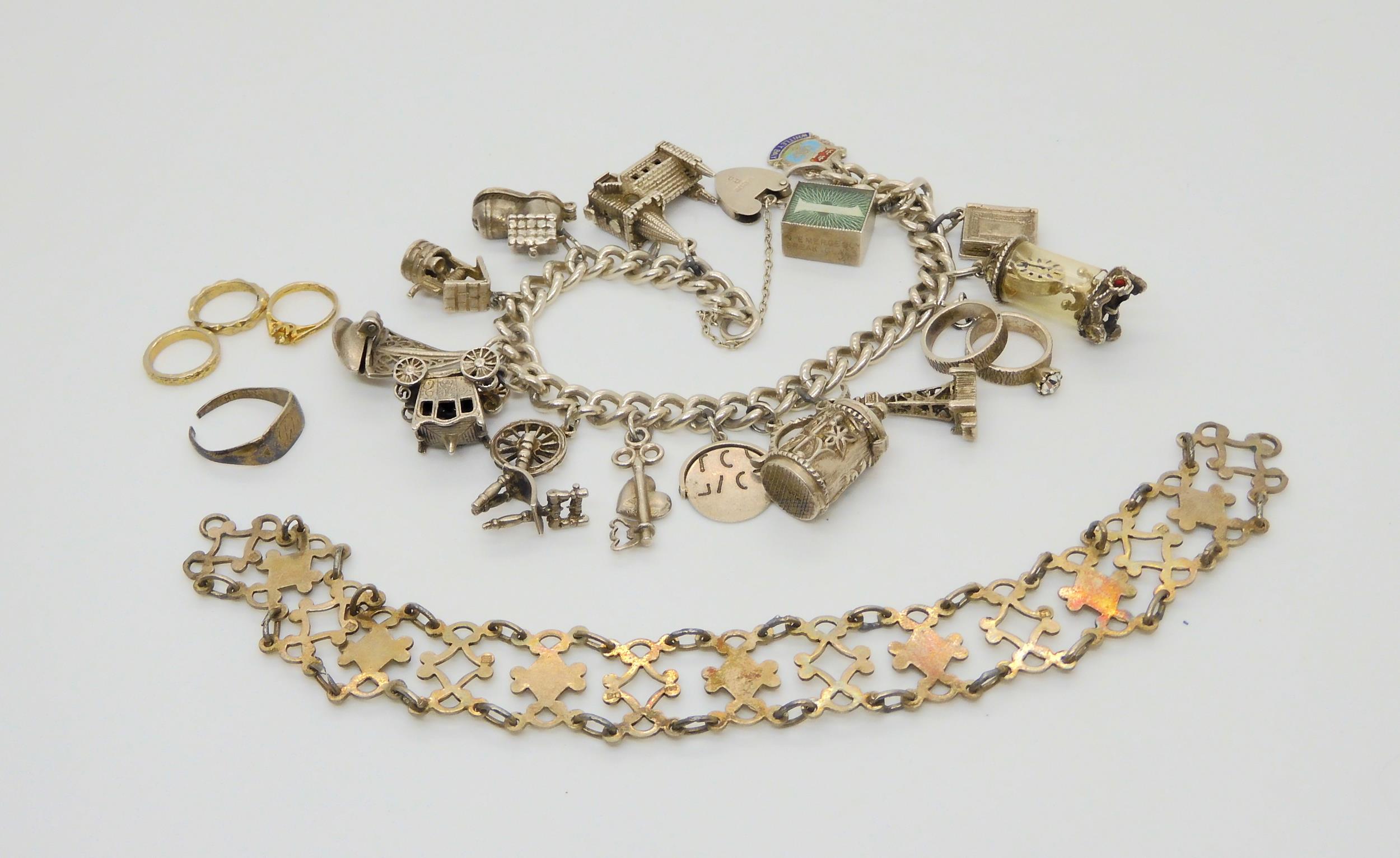 A silver charm bracelet with fifteen attached silver and white metal charms, and a silver bracelet - Image 2 of 3