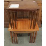 A mid 20th century teak Schreiber nests of three tables and another mid 20th century teak nest of