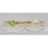 A 9ct gold Ciro pearl ring (signed) size M, together with a 9ct gold peridot ring, size O, weight