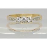 A 14k gold three stone cz ring, size P1/2, weight 1.9gms Condition Report:Available upon request