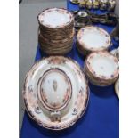 A Royal Crown Derby dinner service comprising dinner plates, side plates, pudding bowls, soup bowls,