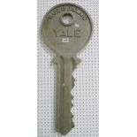 A large metal "Yale" key advertising sign  Condition Report:Available upon request