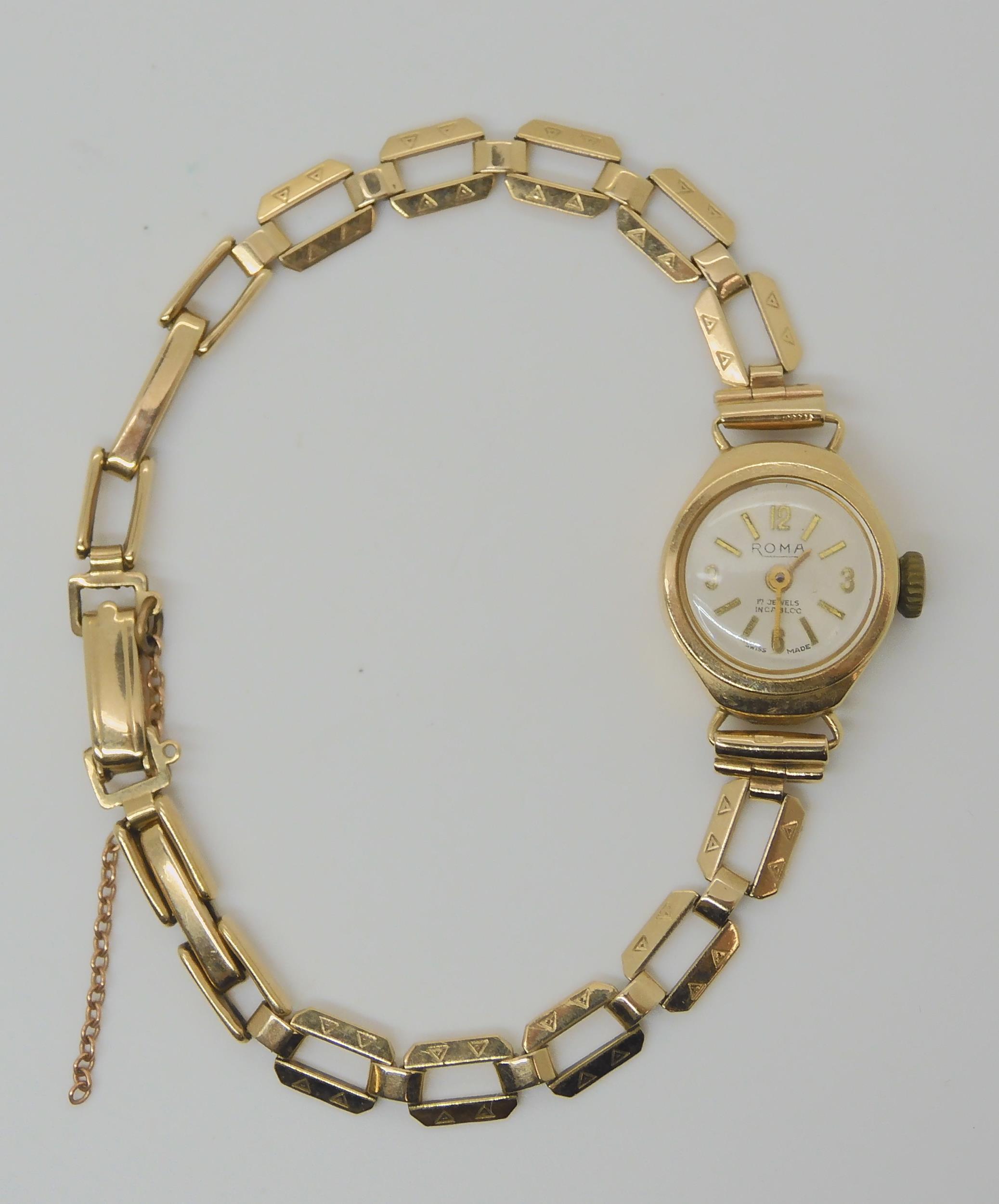 A 9ct gold ladies Roma watch and strap, weight including mechanism 12.5gms Condition Report: