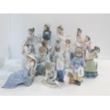 A collection of Nao and Lladro figures of children  Condition Report:Available upon request