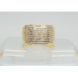 A yellow metal ring set with estimated approx 0.30cts of square cut diamond melee, finger size S1/2,