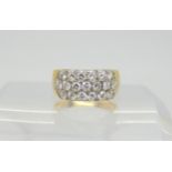 A bright yellow metal ring set with estimated approx 1ct of diamonds. Size I1/2, weight 5gms
