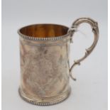 A Victorian silver christening mug, with a double scroll handle and beaded rims, the body with