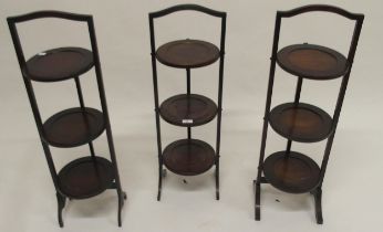 A lot of three assorted three tier folding cake stands (3) Condition Report:Available upon request
