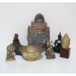 Three assorted tribal wall masks, brass buddha, and other items Condition Report:Available upon