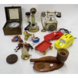 An eclectic mixed lot to include two onyx rotary dial telephones, a Kismet master air pressure