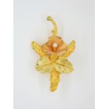An 18k gold pearl set orchid brooch. length 6cm, weight 7.7gms Condition Report:Available upon