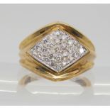 A 9ct gold ring with a diamond set lozenge set panel, set with estimated approx 0.50cts of brilliant