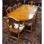 A 20th century maple twin pedestal extending dining table 76cm high x 220cm long x 100cm deep and