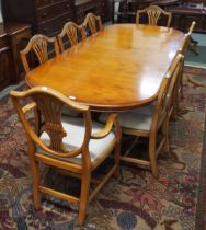 A 20th century maple twin pedestal extending dining table 76cm high x 220cm long x 100cm deep and