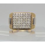 A yellow and white metal pave diamond set ring, set with estimated approx 1.25cts of brilliant cut